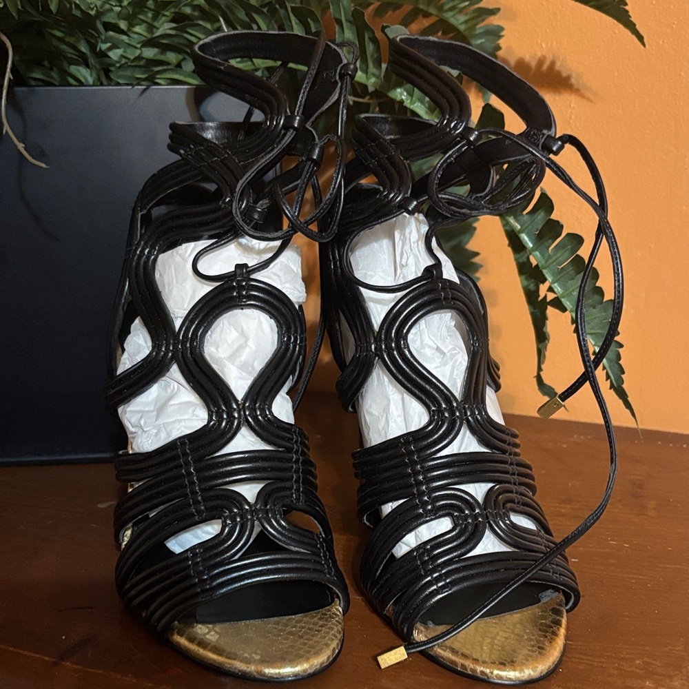 BCBGeneration “Jax” Black and Gold Strappy Heels
